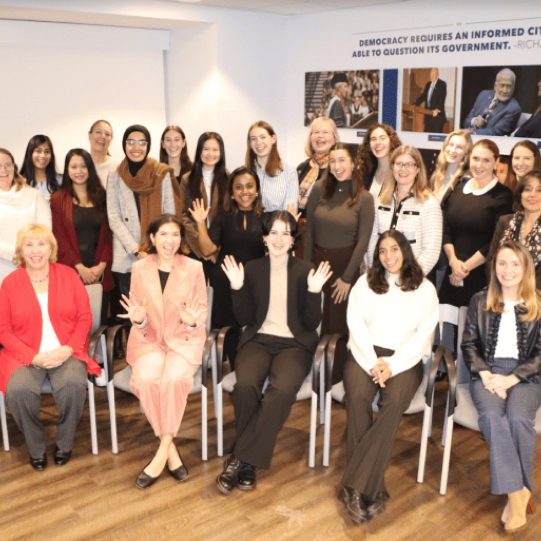 A group of I/WE members standing for a photo