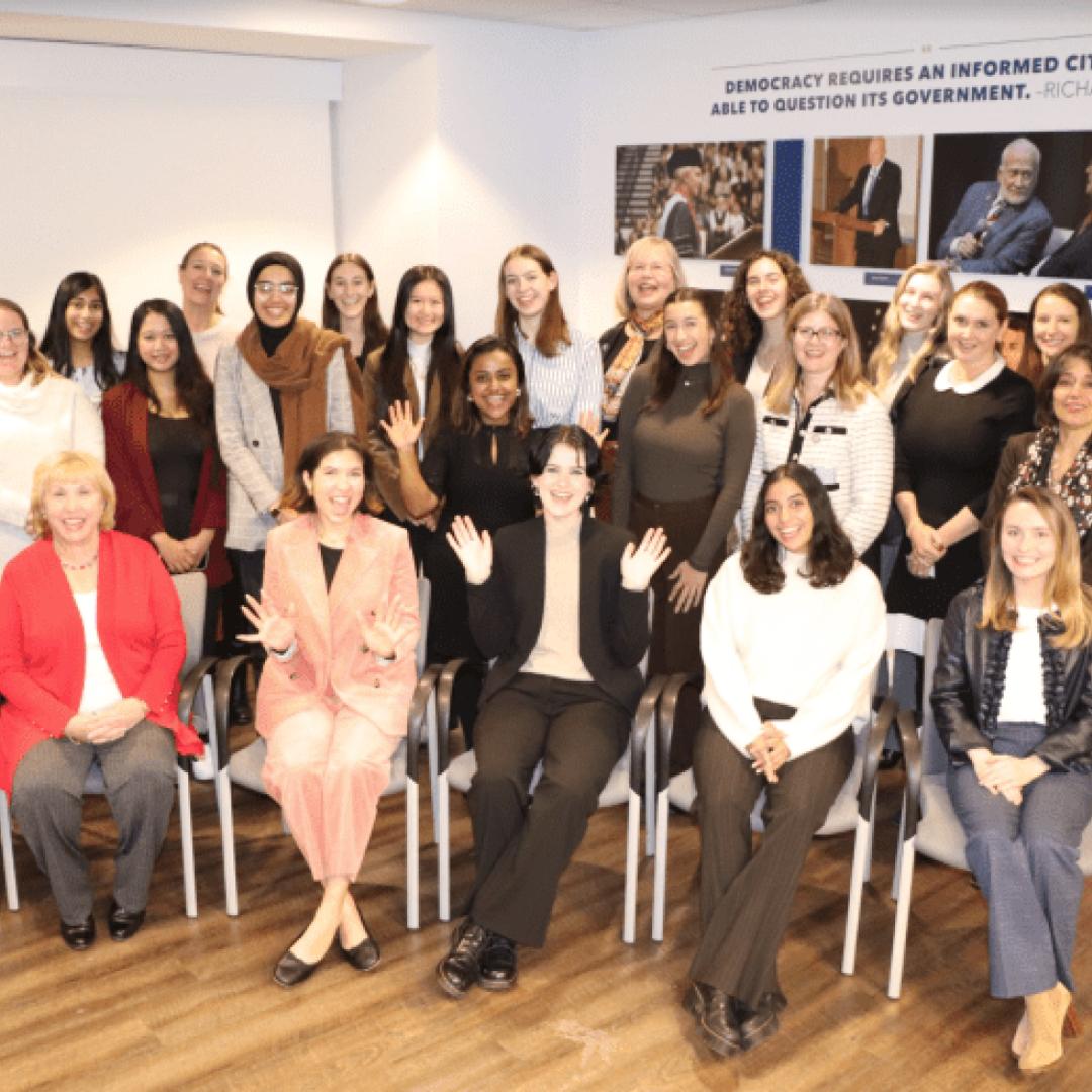 A group of I/WE members standing for a photo